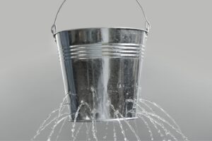 Leaking bucket showing breakdowns in sales funnels in online marketing